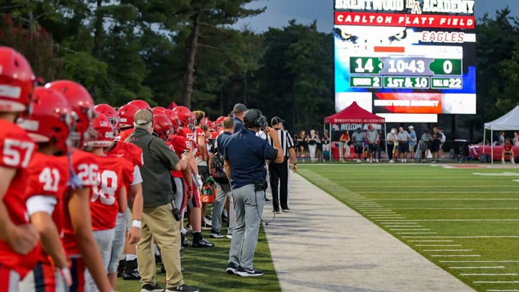 Sports Graphics on an LED Video Board at a live football game including a Scorebug.